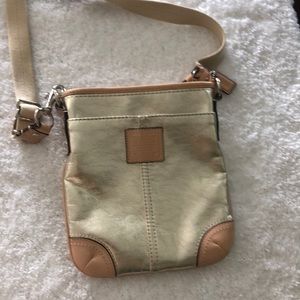 Gold leather Coach crossbody.